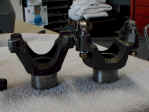 Dana yokes: original strap style (L) and replacement u-bolt style (R).