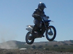 Little Berkeley jumping his TT-R90. Dang! I missed his *huge* jump.