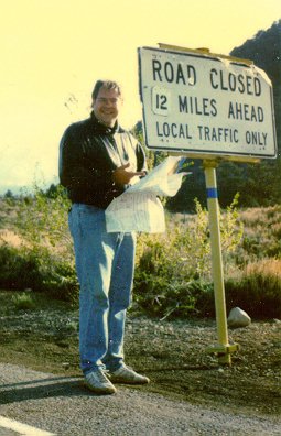 Tom with Map at "Road Closed" Sign